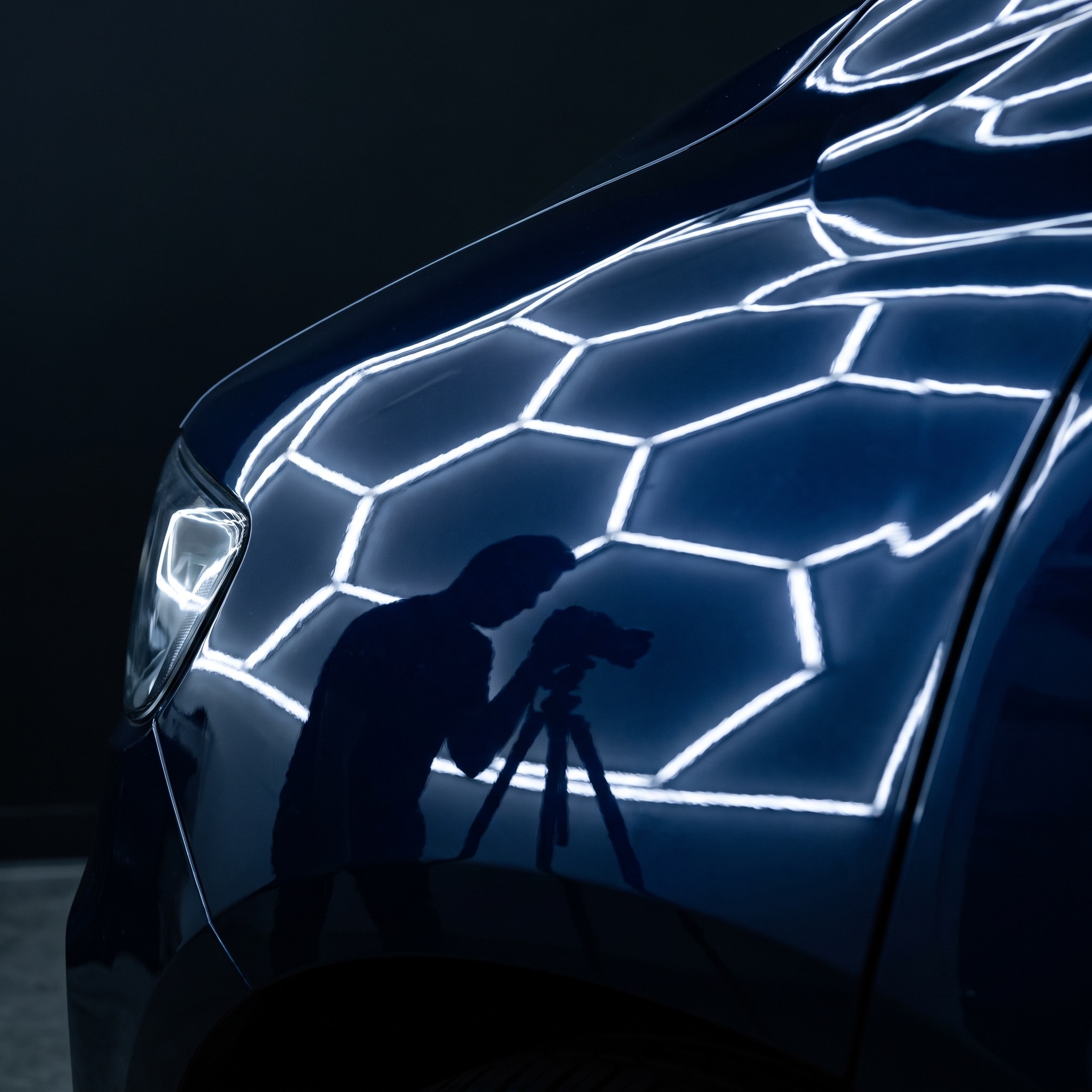 Ceramic-coated dark blue fender mirroring a hex LED light bar